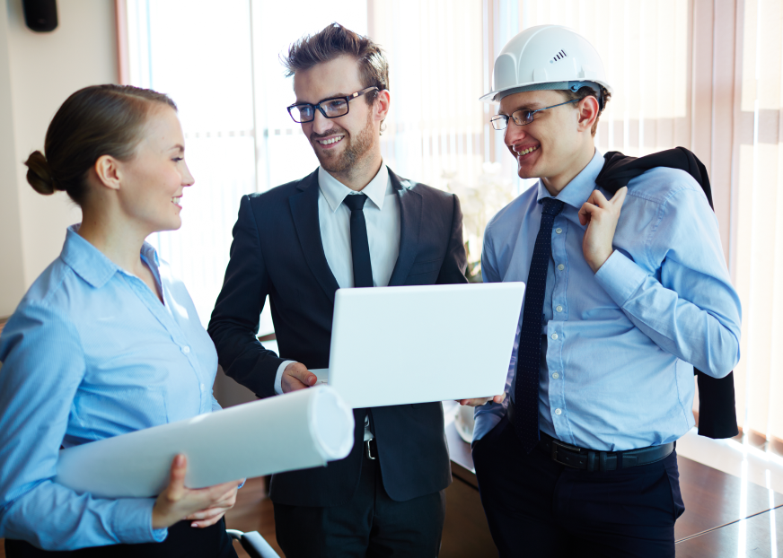 Contractors reviewing project plans with an advisor, representing contractors
